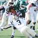 Eastern Michigan senior Nate Wilson gets caught up by sophomore Johnnie Simon during the first quarter against Western Michigan at Rynearson Stadium on Saturday afternoon. Melanie Maxwell I AnnArbor.com